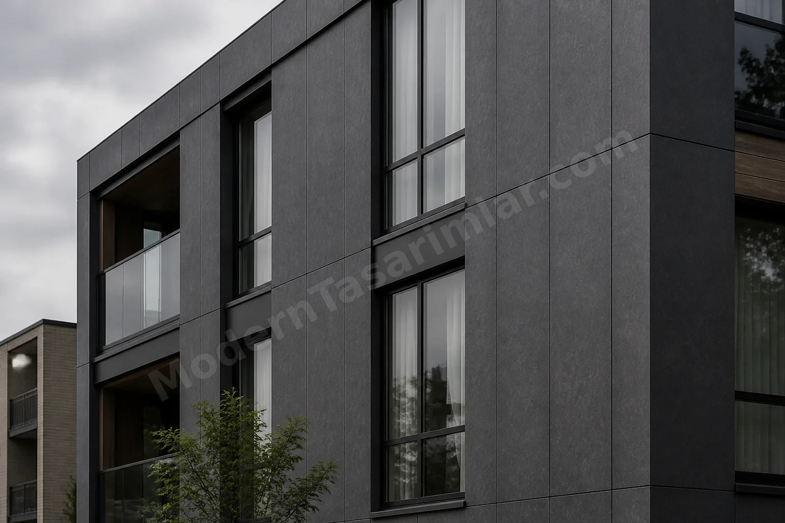 Kömür grisi HPL taş dokulu panellerle dar düşey derzler
